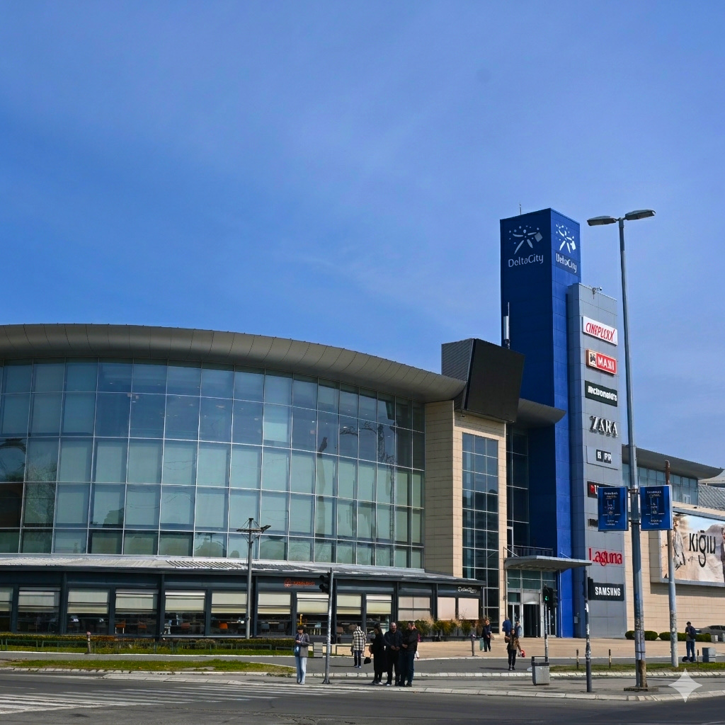 Delta City — zaobljena staklena fasada tržnog centra i reklamni toranj sa logotipima